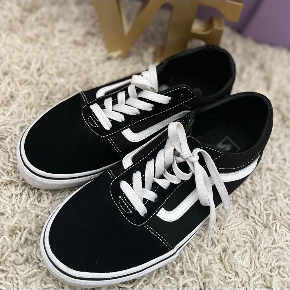 Black Vans Youth Size 6.5. Gently used and well taken care of.  Worn often.